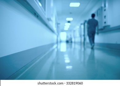 Blurred medical background. Moving human figure in the hospital corridor
 - Powered by Shutterstock