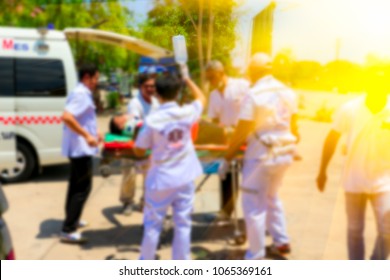 Blurred Medical Commander Of Emergency Response Team And Rescue Team Save Life The Patient From Car Accident Transfer Moving To The Ambulance,CPR Training.