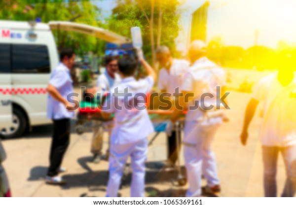 Blurred Medical commander of\
Emergency response team and rescue team save life the patient from\
car accident transfer moving to the ambulance,CPR\
training.