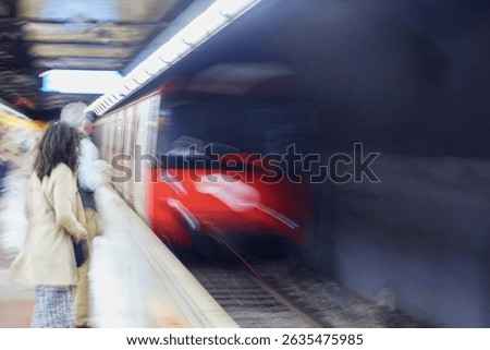 Blurred metro sub underground train arriving at station in Barcelona