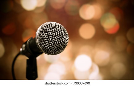 Blurred Of Microphones In Seminar Room, Talking Speech In Conference Hall Light With Microphone And Keynote. Speech Is Vocalized Form Of Communication Humans.