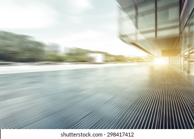 Blurred Modern Building Glass Wall And Empty Path