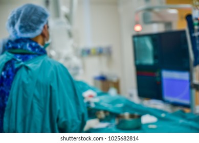 Blurred of modern Cath Lab with doctor, nurse and patient in hospital,patient during  treatment in Cath Lab.