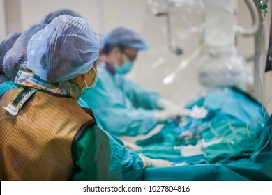 Blurred of modern Cath Lab with doctor, nurse and patient in hospital,patient during  treatment in Cath Lab.
