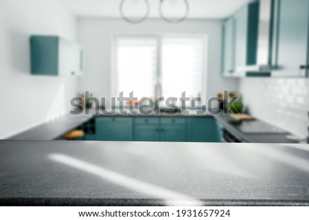Blurred modern kitchen interior and desk space and outstanding furniture. 