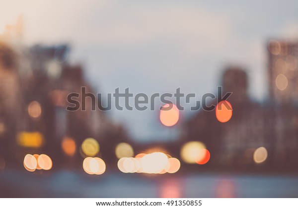 Blurred morning\
city street lights background\
