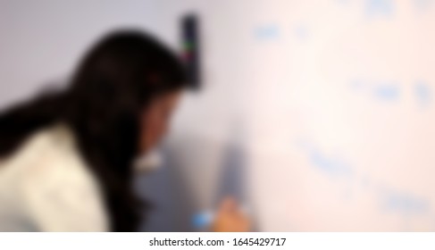 Blurred Motion Of Asian Female Software Engineer On Daily Activity At Office.meeting,making Concept,coding And Presentation. Suitable For Technology Concept.