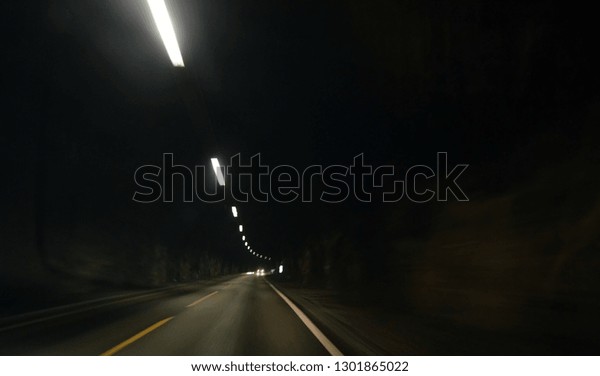 Blurred motion\
background of road tunnel in\
Norway