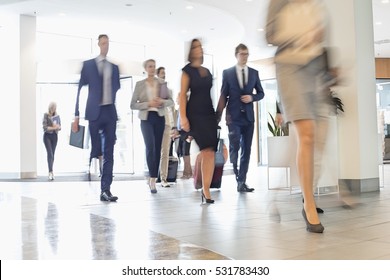 Blurred Motion Of Business People Walking At Convention Center