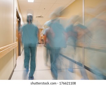 Blurred Motion Doctors And Nurses Walking In Hospital Corridor