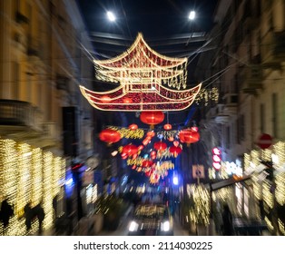 Blurred and motion effect of decoration in Chinatown streets of Milan for the Chinese New Year.