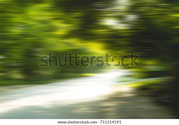 Blurred in motion green nature landscape. Concept\
of blurred field and woods  green view, high speed view shot from\
fast car . Photo can be used as a concept background , wallpaper or\
banner, poster.