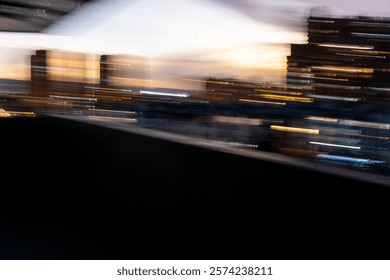 Blurred motion photography of urban skyline with residential buildings during a vibrant sunset, copy space 