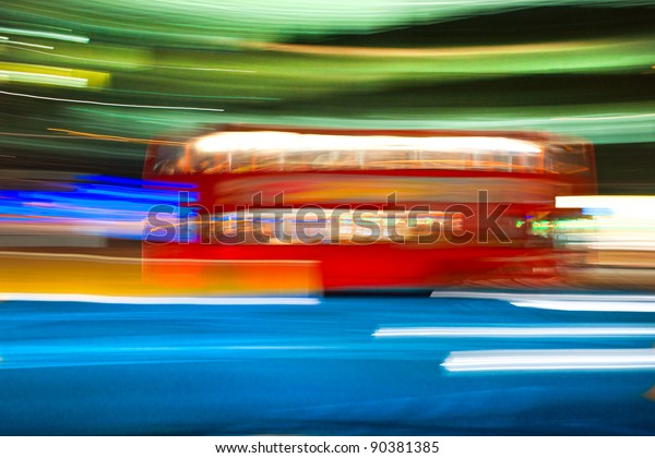 Blurred motion picture of a double-decker bus,\
London, Uk.