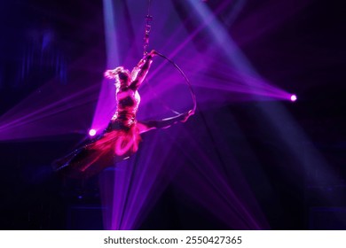 Blurred Movement of The Woman with Hula Hoop in Air. - Powered by Shutterstock