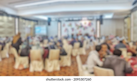 Blurred Multiethnic People In Gala Dinner At Hotel Ballroom.