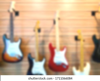 Blurred Music Store Interior Space With Electric Guitar Background.