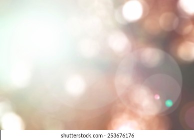 Blurred Nature Background With Sun Flare And Bokeh In Orange Red Tone In Autumn Season Concept