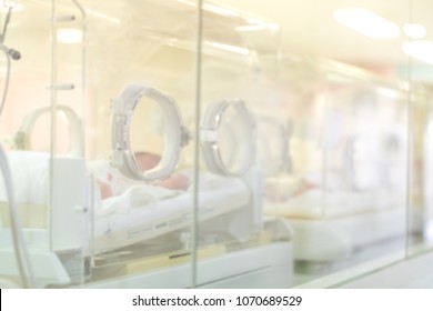 Blurred Newborn Baby Room In Hospital. Blurry Infants In Incubator In Neonatal Intensive Care Unit (NICU)