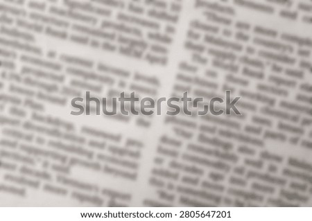 Blurred newspaper article text columns representing global market research data