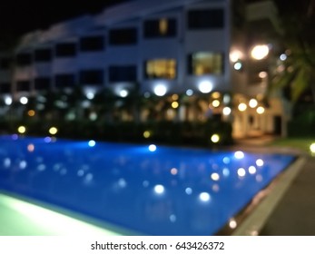 Blurred Night Light Reflection In Swiming Pool Blue Water In The Hotel