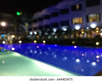 Blurred Night Light Reflection In Swiming Pool Blue Water In The Hotel