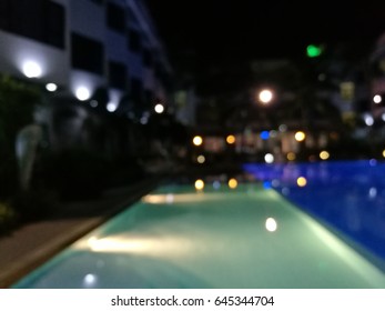 Blurred Night Light Reflection In Swiming Pool Blue Water In The Hotel