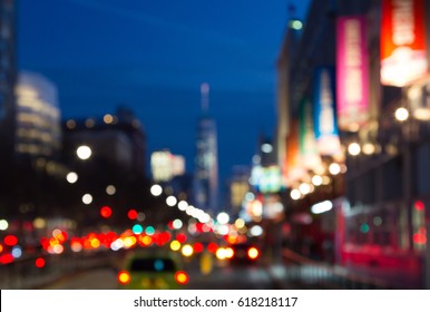 Blurred Night Lights Of Manhattan Street Scene Near Chelsea Piers In New York City, NYC