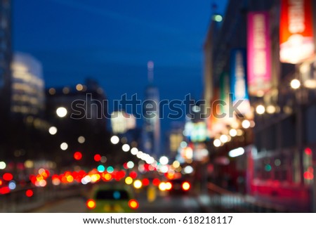 Blurred night lights of Manhattan street scene near Chelsea Piers in New York City, NYC