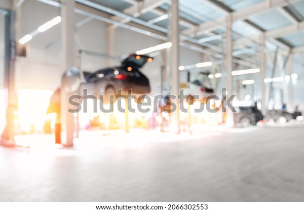 Blurred no focus background repair car service\
with sun light for copy\
space.
