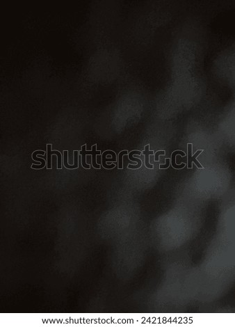 Blurred objec of the stone in the night capture so amuse gradient of black and snip the white light like whirl effect beside
