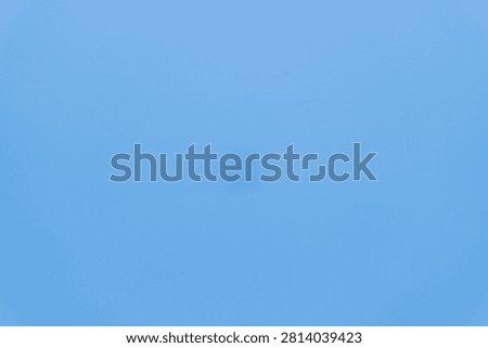 Blurred object in clear blue sky background.