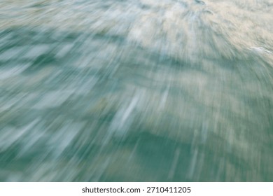 Blurred ocean waves in motion capturing dynamic movement and energy.