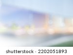 BLURRED OFFICE BACKGROUND, MODERN LIGHT BUSINESS HAL WITH CITY LIGHTS REFLECTED IN THE WINDOWS, URBAN BACKDROP, COMMERCIAL STORE INTERIOR BLUR