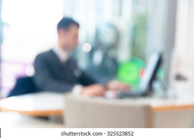 blurred office background , office worker at the computer, working day