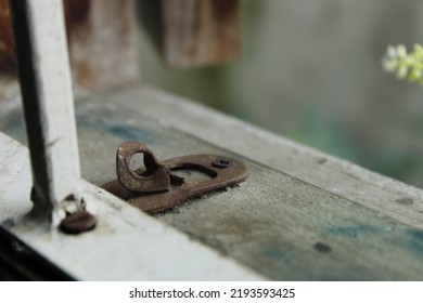 Blurred Old And Rusty Window Latch Lock