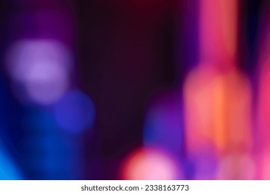 Blurred, out of focus photo, night neons bokeh, vivid blue and purple colors, cyberpunk atmosphere. Amazing wallpaper backdrop. Night city street. - Powered by Shutterstock