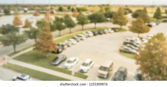 Blurred panorama aerial view abstract parking lot of office park in Texas, America during fall season with colorful autumn leaves - Shutterstock ID 1255309876