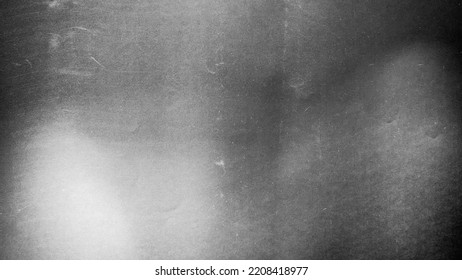 
						Blurred paper black gray light background.
						Grunge film grain effect distressed scary texture.