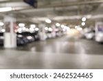 Blurred parking image,Parking in interior shot of multi-story car park, underground parking with cars.