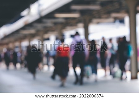 Blurred passenger walking with waiting in train out the South station with rush hour in Boston, Massachusetts, USA. 