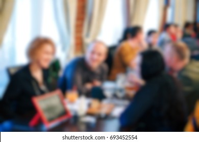 Blurred People In The Banquet Room With Gala Dinner.