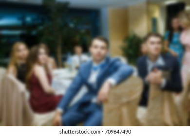 Blurred People In The Banquet Room With Gala Dinner.