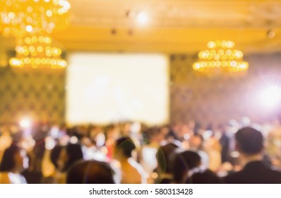 Blurred People  Eating And Talking In  Hotel Ballroom Party