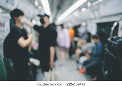 Blurred people onboard a train on the Seoul underground rail system. - Shutterstock ID 2226159471
