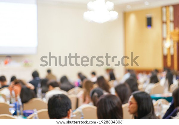 Blurred people sitting in business seminar
room in hotel business
background