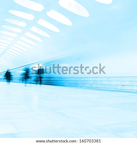 Blurred people and  train in motion blur at subway station.