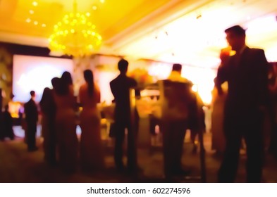 Blurred People And Waiter On Gala Dinner Party In Ballroom