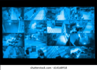 blurred photo, Blurry image, closed circuit camera,security system walkie-talkie while looking at CCTV footage. - Shutterstock ID 614168918