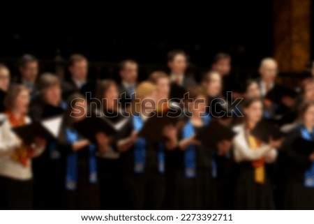 Blurred photo of choir singing in concert